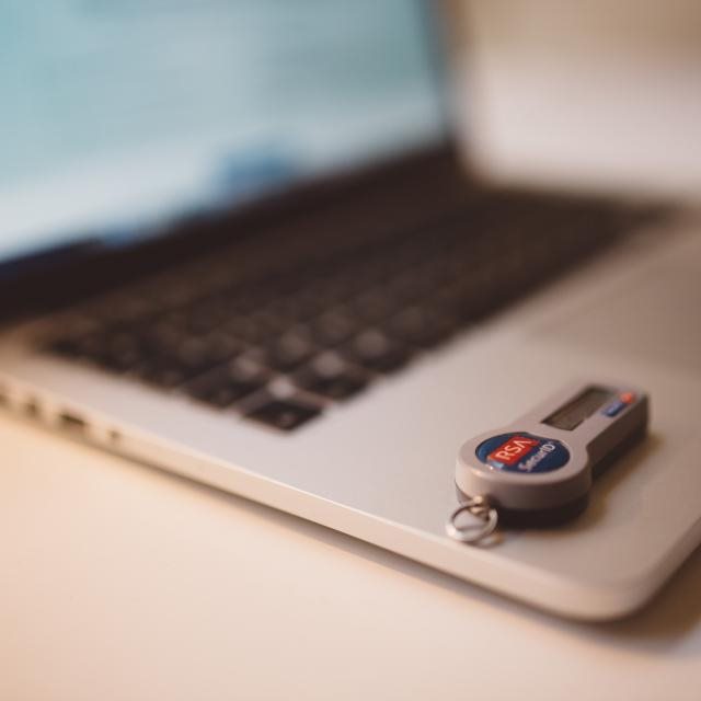 A laptop with a security key plugged in