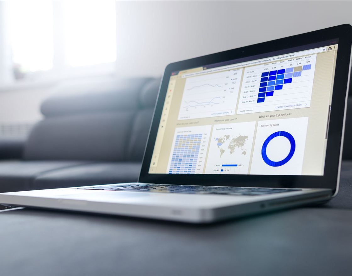 A laptop showing a data analytics dashboard
