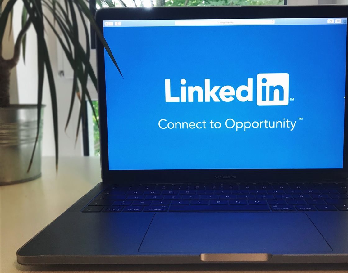 A laptop screen showing LinkedIn