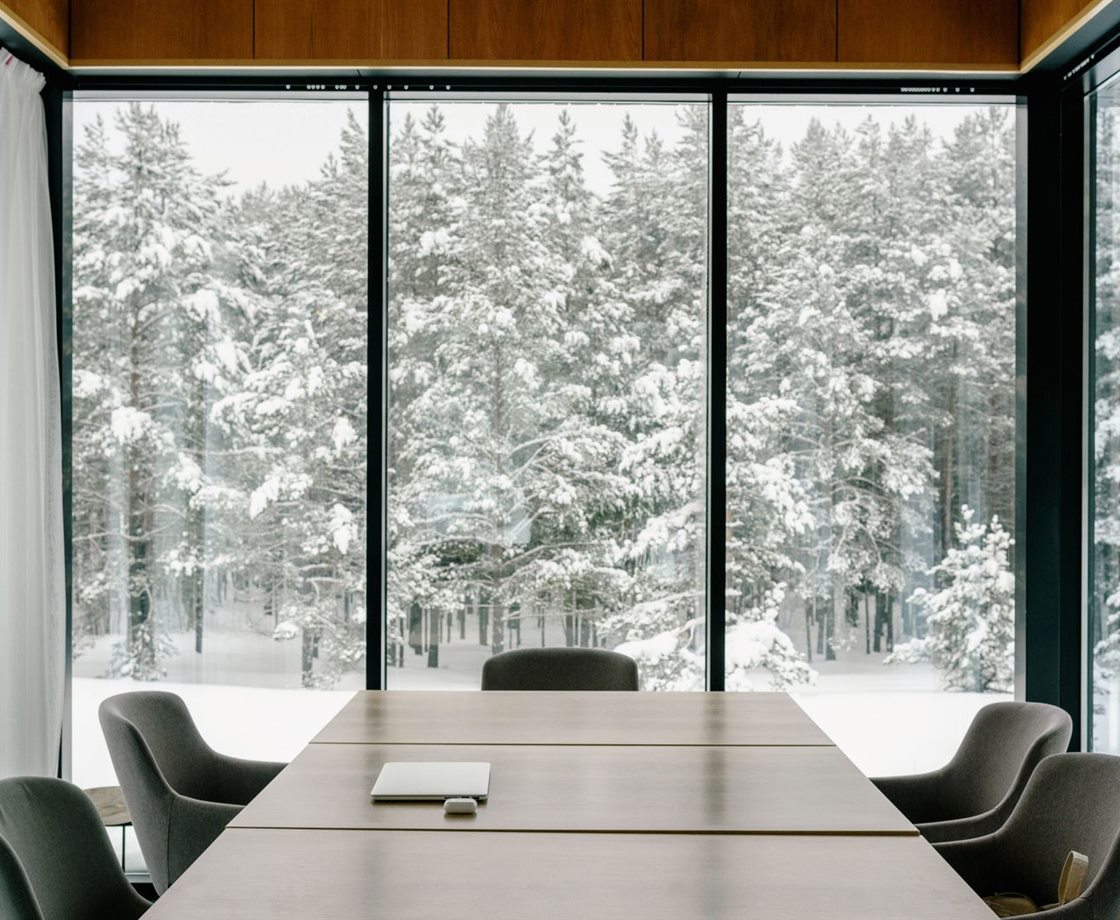 A modern conference room with large windows