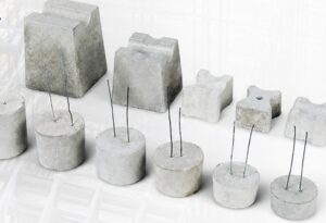 Concrete cover blocks by PM Spacers in different sizes, many with binding wire